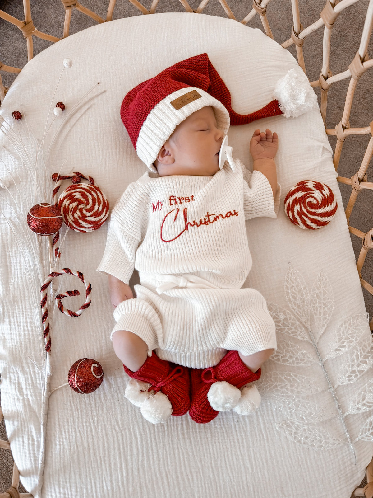 Newborn in Little B's My First Christmas Fine Rib Shirt Set with Santa hat and booties