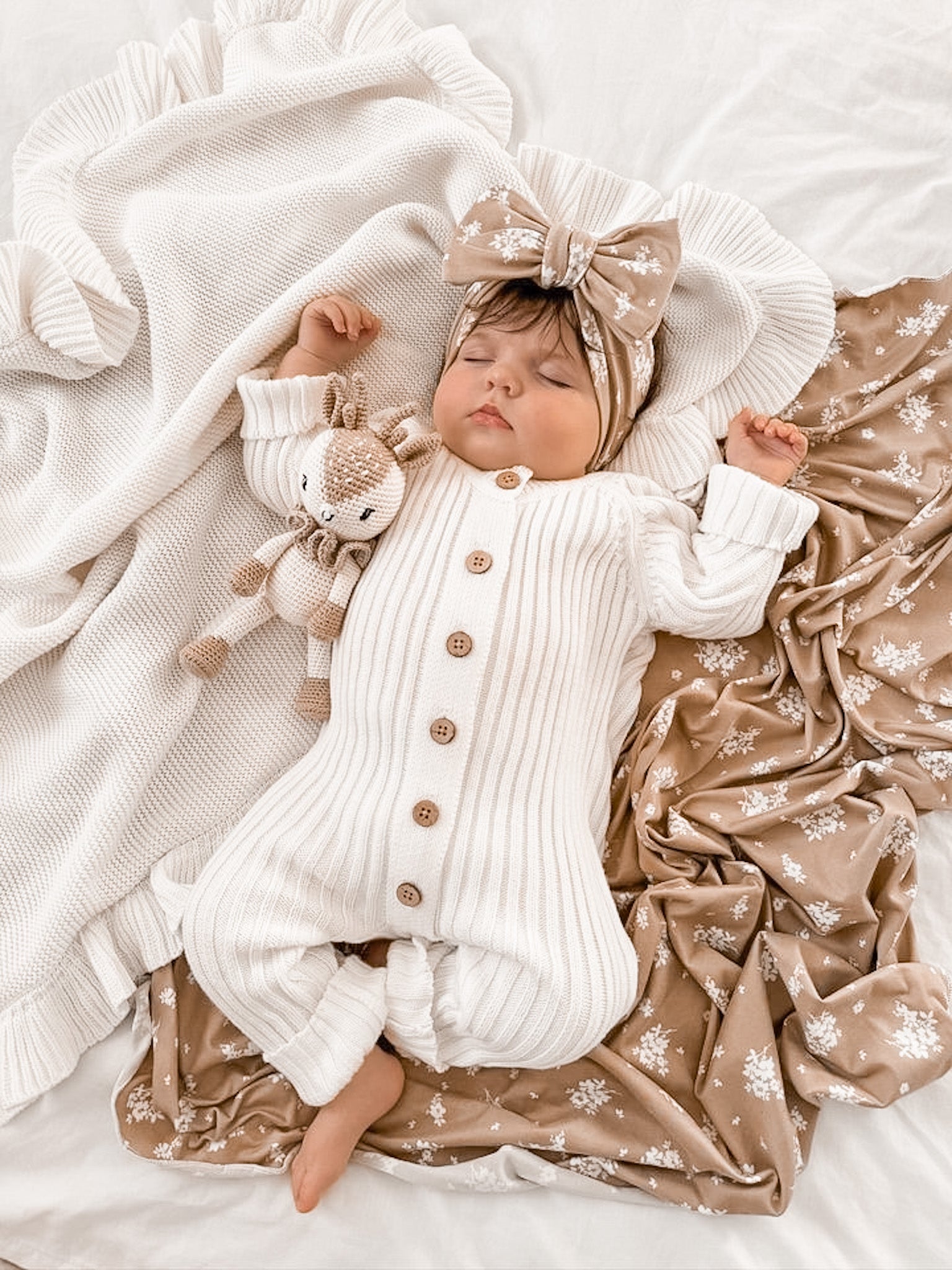 Little B's Retail Knitted Cotton Ribbed Romper in Milk, with a matching bow and knitted deer toy
